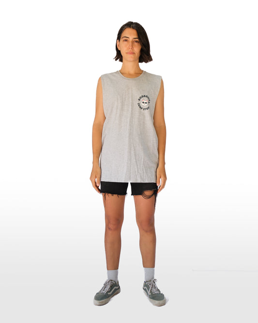 Person wearing a sleeveless gray shirt with a logo on a white background